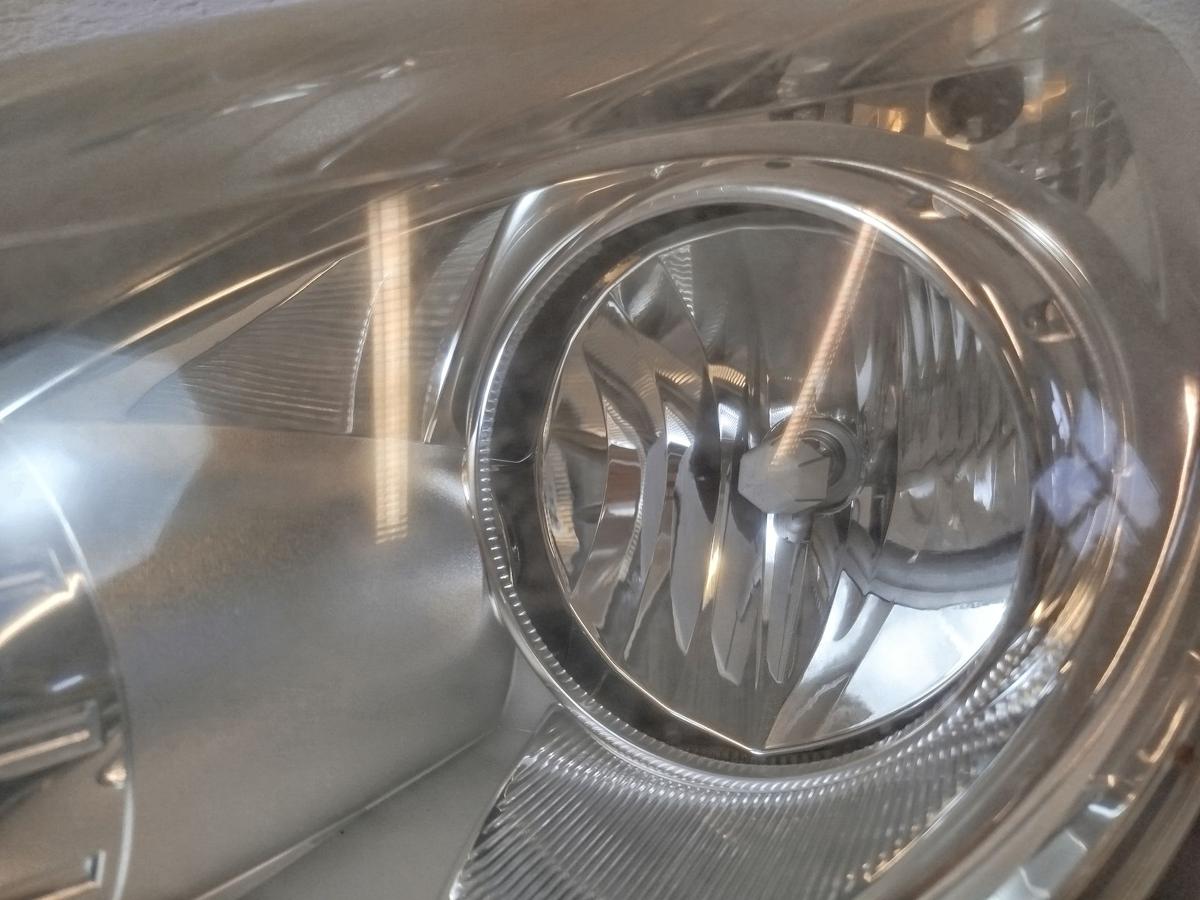 Opel Corsa D Scheinwerfer links Frontscheinwerfer Halogen Lampe OEM tr&uuml;b