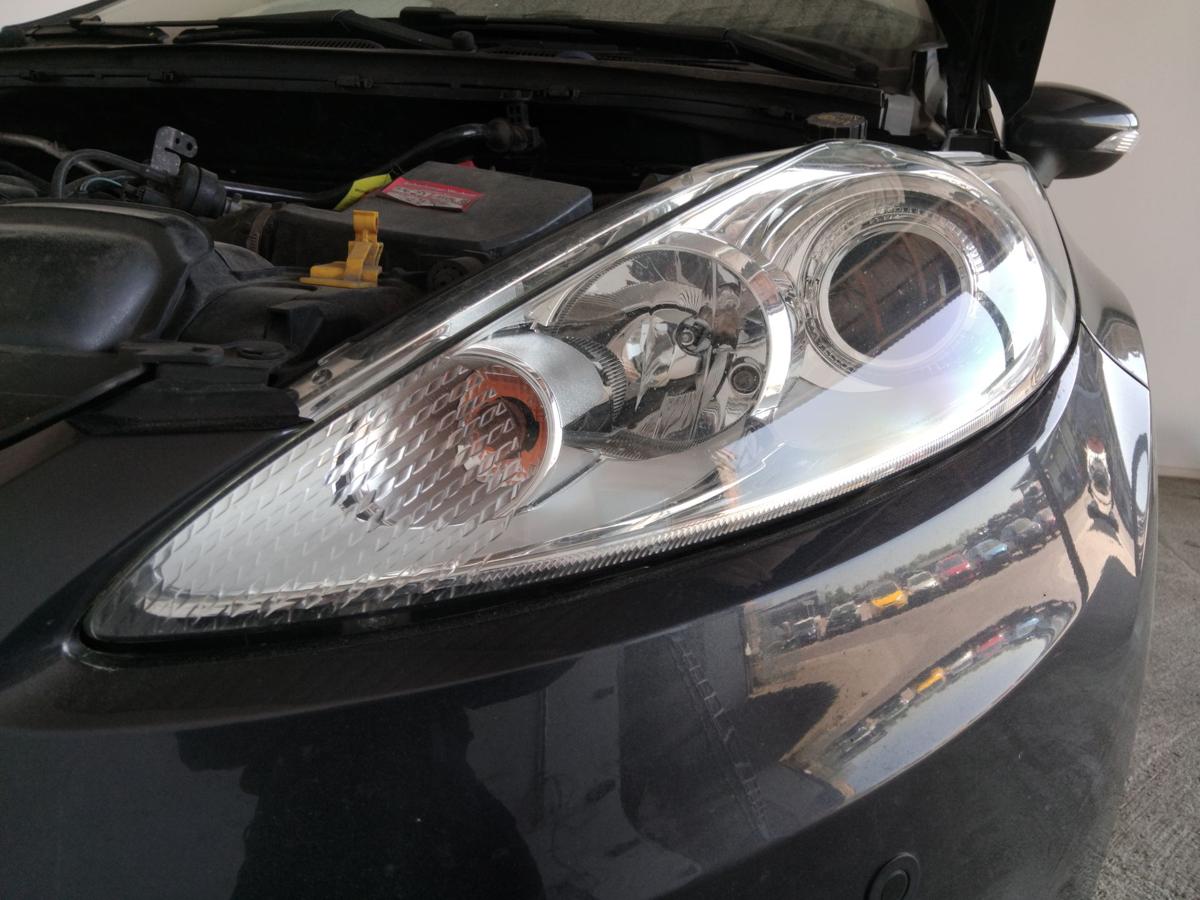 Ford Fiesta JA8 original Scheinwerfer links Hella Halogen mit LWR BJ2009