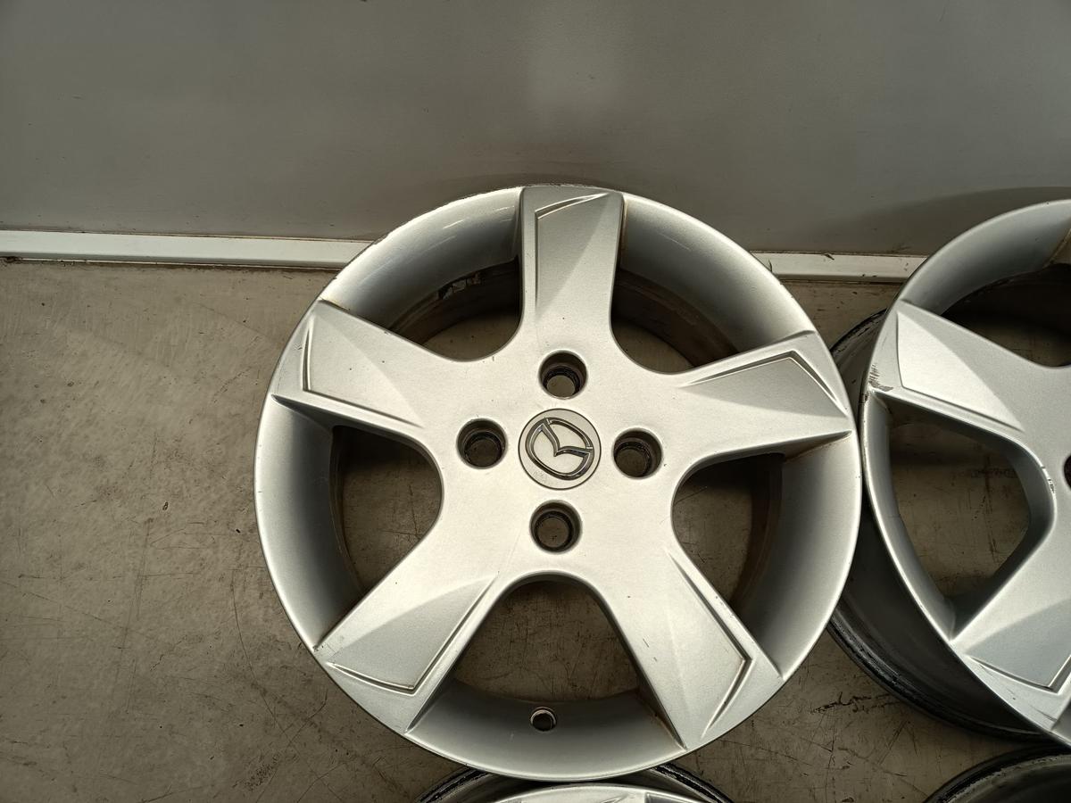 Mazda 2 Dy orig Satz Alufelgen 6Jx15 ET52,5 4x108 Bj 2006/ O.E 9965M46050