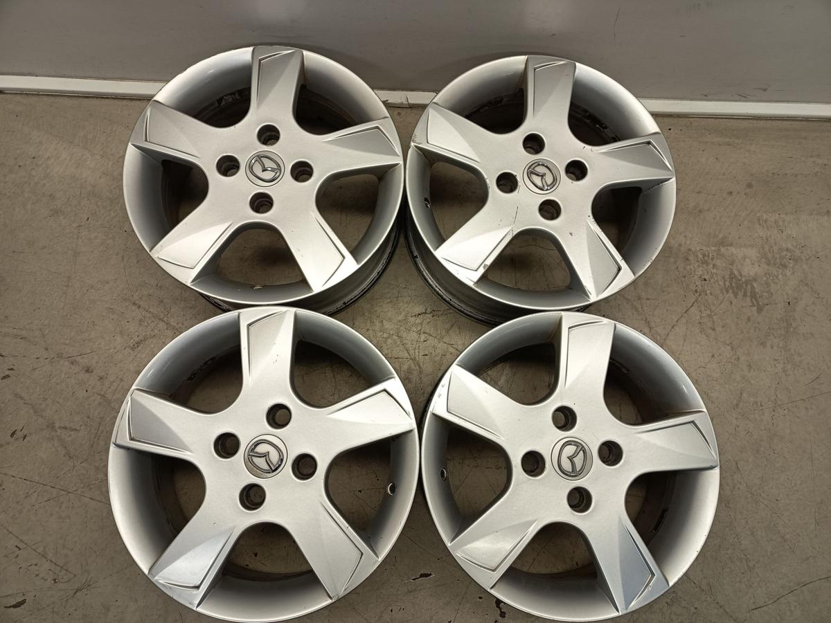 Mazda 2 Dy orig Satz Alufelgen 6Jx15 ET52,5 4x108 Bj 2006/ O.E 9965M46050