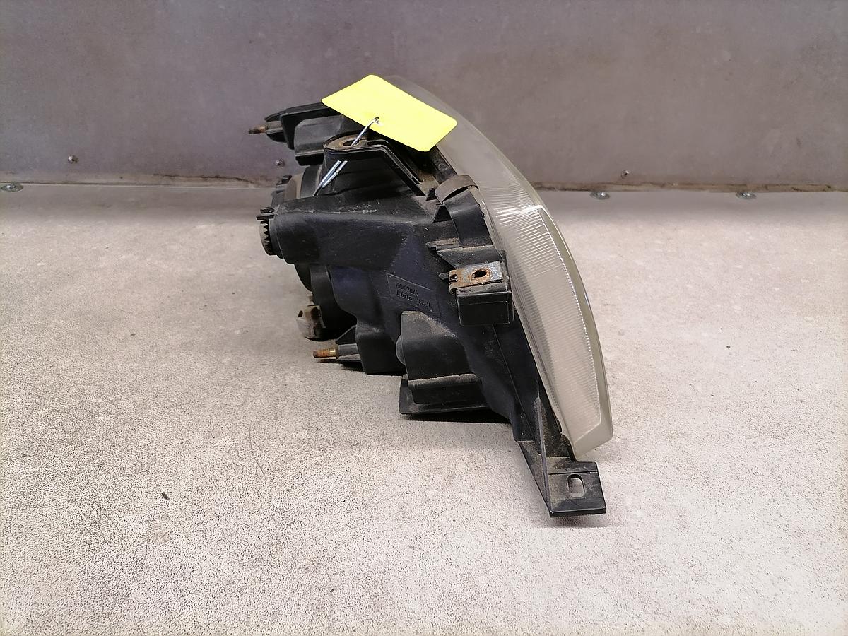 Suzuki Baleno BJ98 Scheinwerfer vorn links Lampe 100-32074 koito