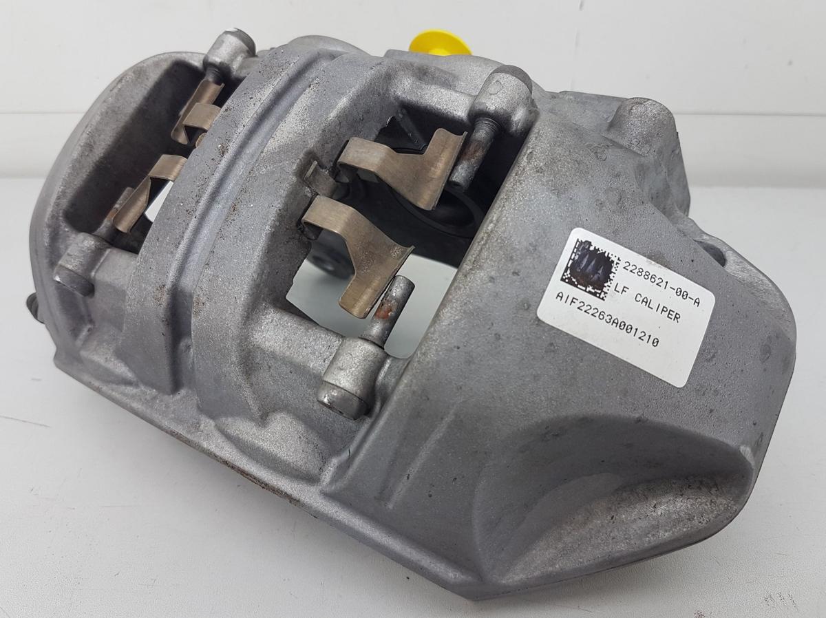 Tesla Model Y Bremssattel vorn links Bj2022 2288621-00-A inkl Tr&auml;ger