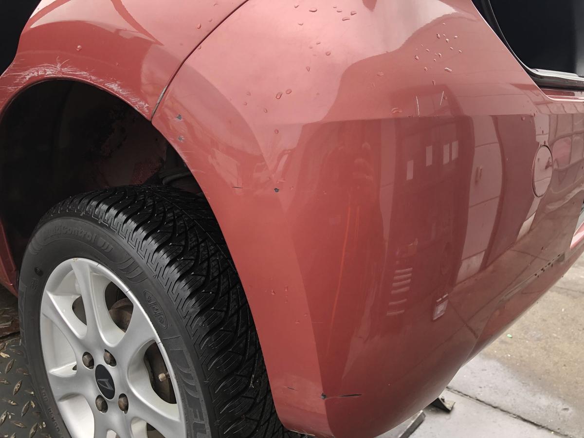 Daihatsu Sirion M300 original Stoßstange Fänger hinten/Heck R43 Korall Bj 2005