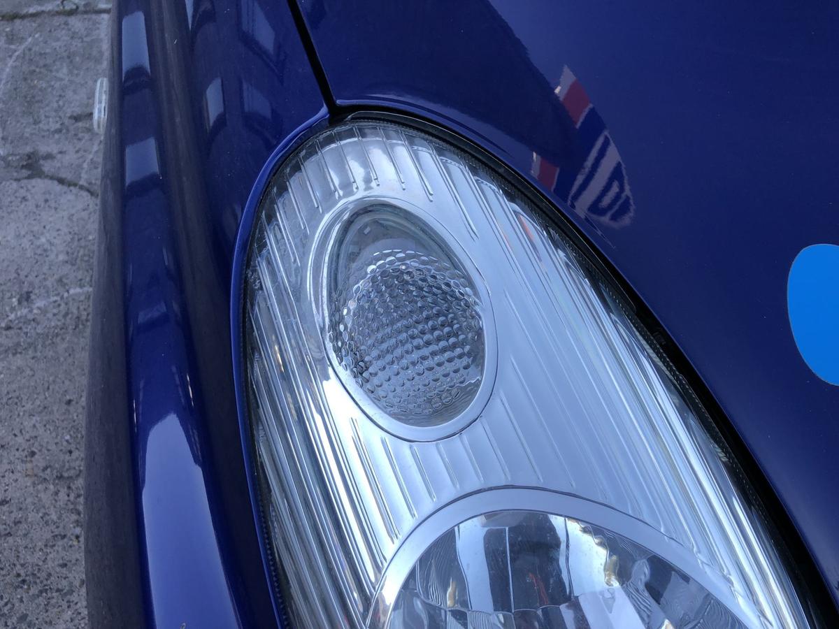 Nissan Micra K12 Scheinwerfer links Frontscheinwerfer Zubehörteil TYC Text lesen