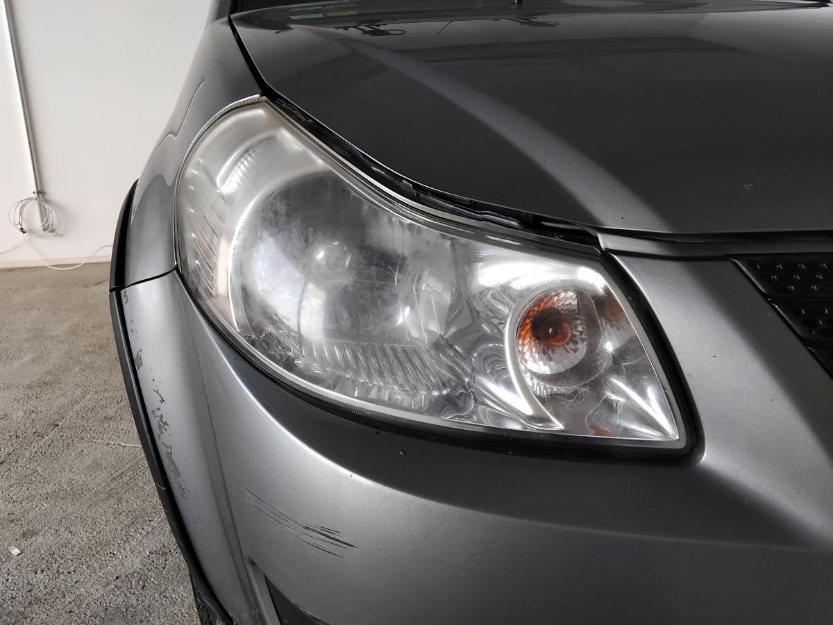 Suzuki SX4 original Scheinwerfer rechts Halogen mit LWR vergilbt trüb BJ2009