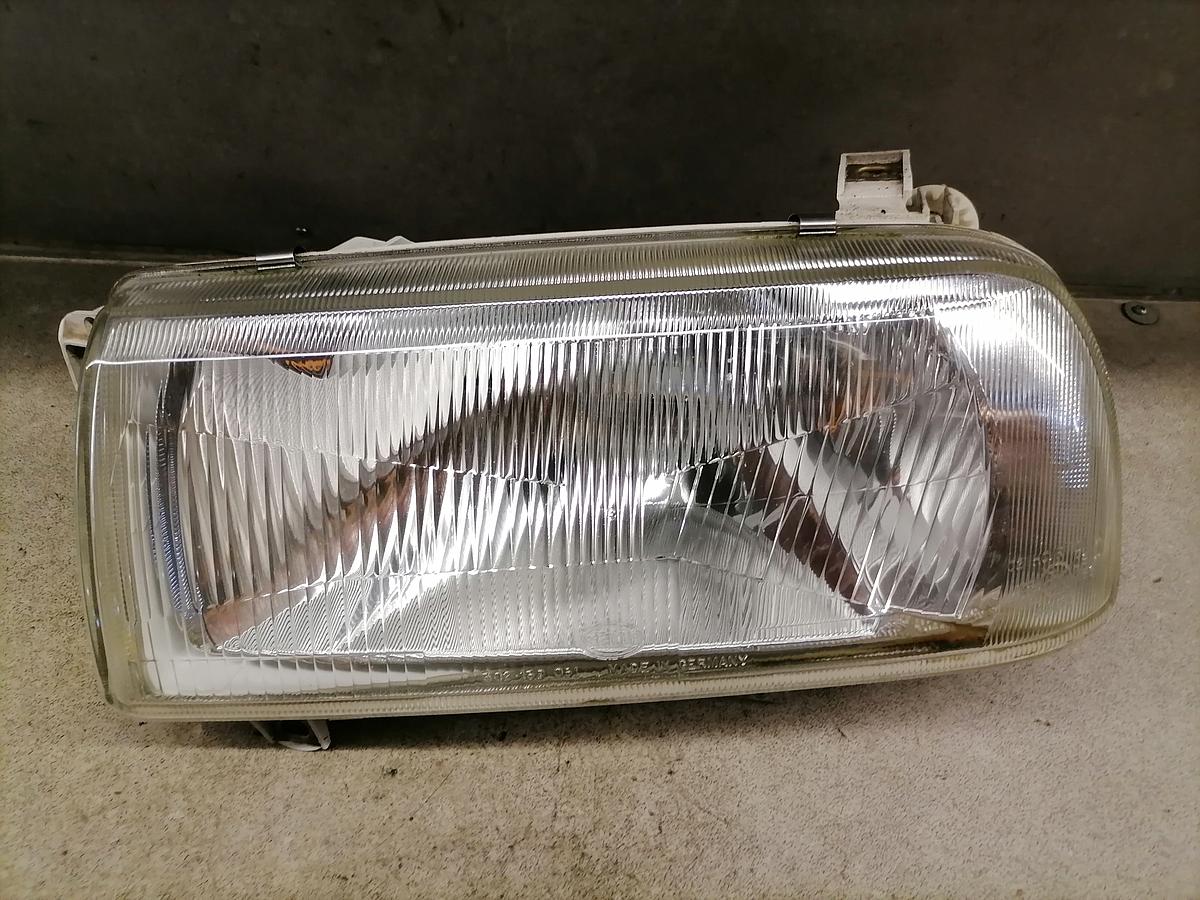 VW Vento Scheinwerfer links vorn Halogen Lampe Hella BJ93-95