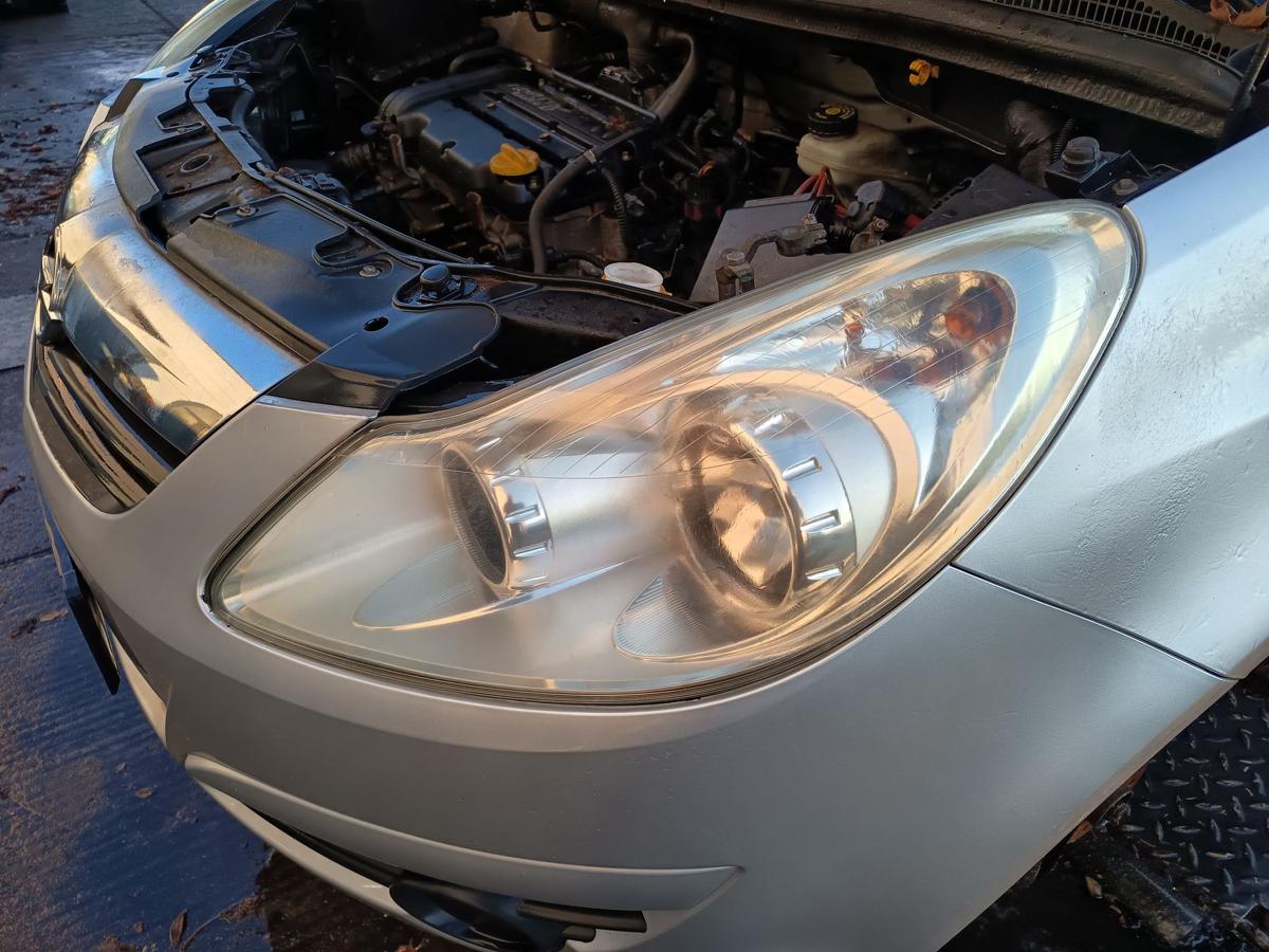 Opel Corsa D original Scheinwerfer links Halogen/Haupt/Licht/Front Bj 2007