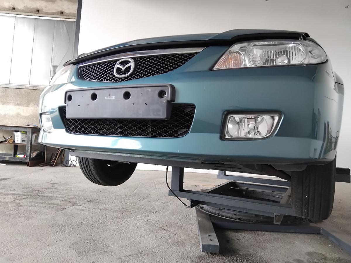 Mazda 323 F BJ orig Stossf&auml;nger Sto&szlig;stange vorn BJ2001 Facelift 23G orient green pearl