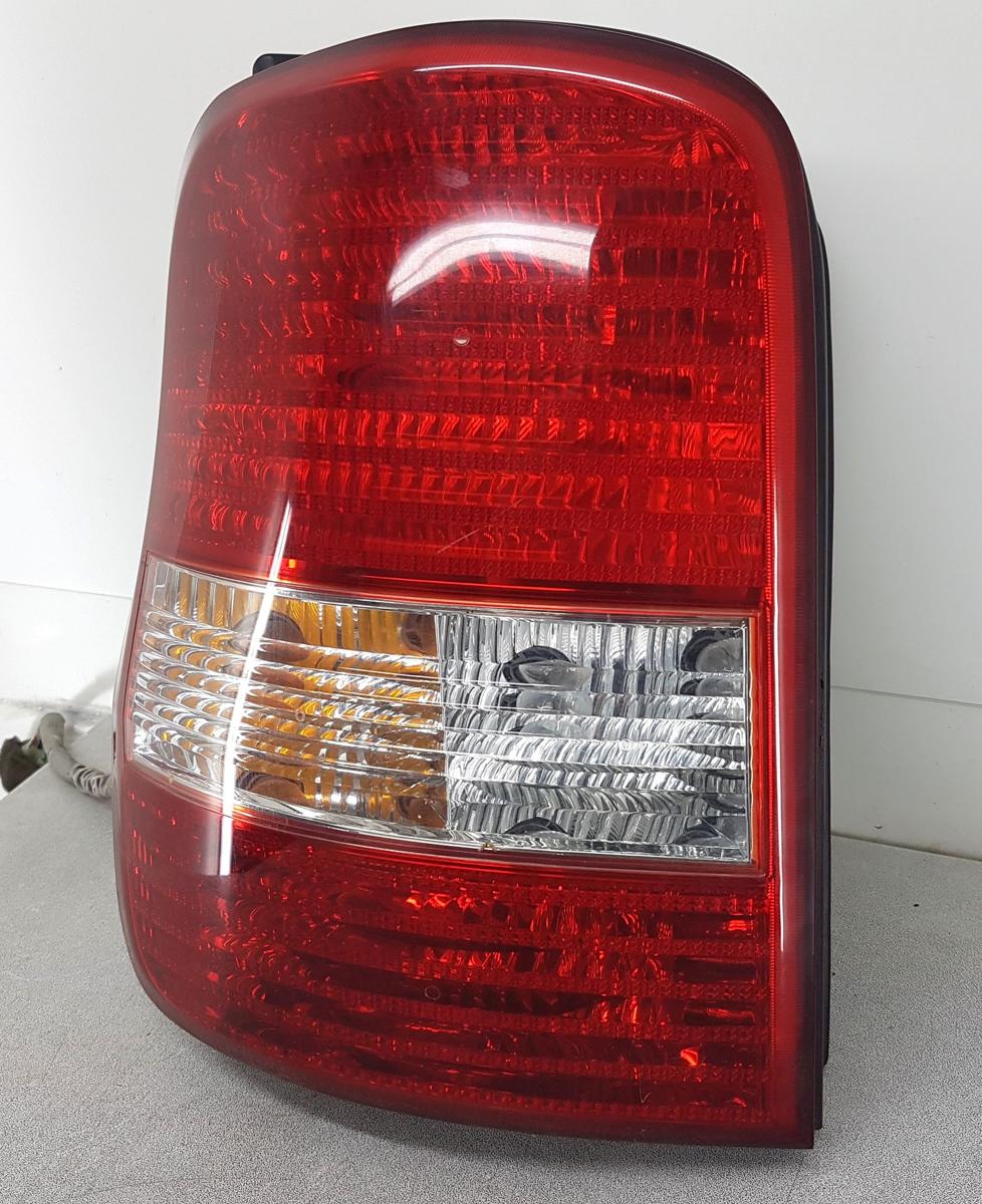 Kia Carnival Rückleuchte Rücklicht links in rot weiss Bj2005 Modell ab2002