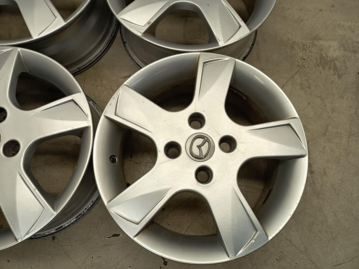 Mazda 2 Dy orig Satz Alufelgen 6Jx15 ET52,5 4x108 Bj 2006/ O.E 9965M46050