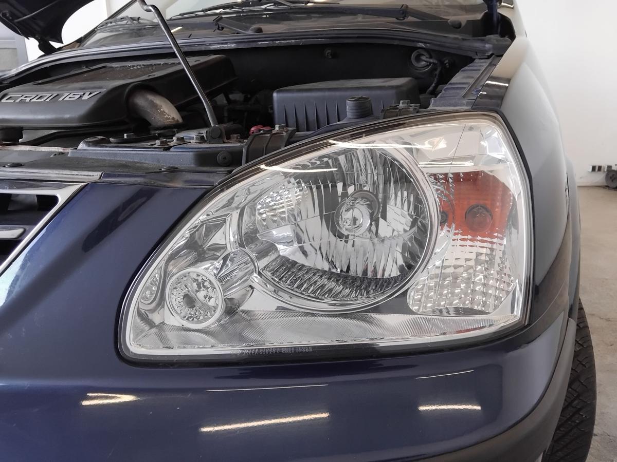 Kia Carens II original Scheinwerfer links Halogen mit LWR BJ2002