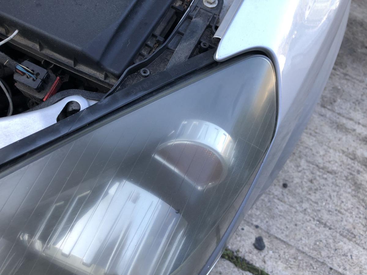 Opel Astra H Caravan Scheinwerfer links Hauptscheinwerfer Halogen Tr&uuml;b Hella