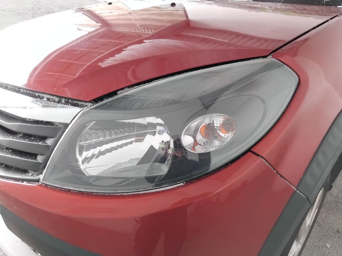 Dacia Sandero 1 orig.Scheinwerfer links f&uuml;r Bowdenzug LWR BJ2010 schwarz