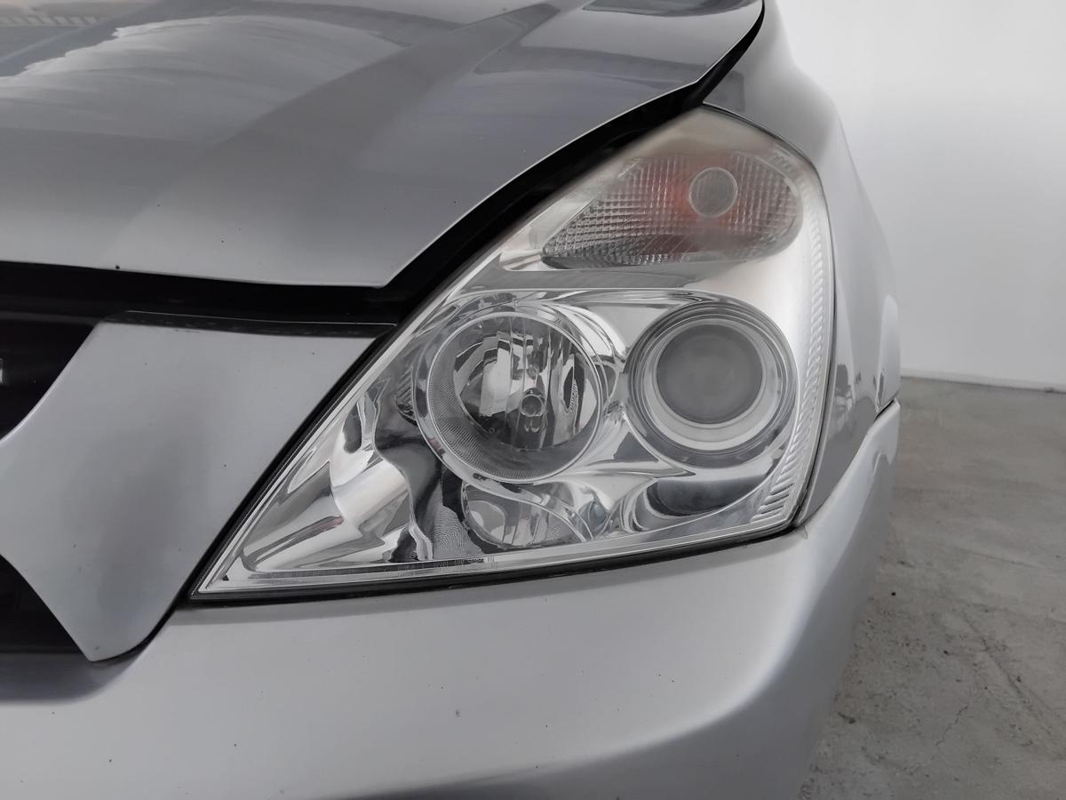 Kia Carnival III MB original Scheinwerfer links Halogen mit LWR BJ2007