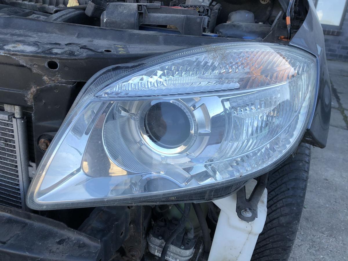 Skoda Fabia 5J Scheinwerfer links Bi Halogen mit Linse Hella bis 2010 OEM