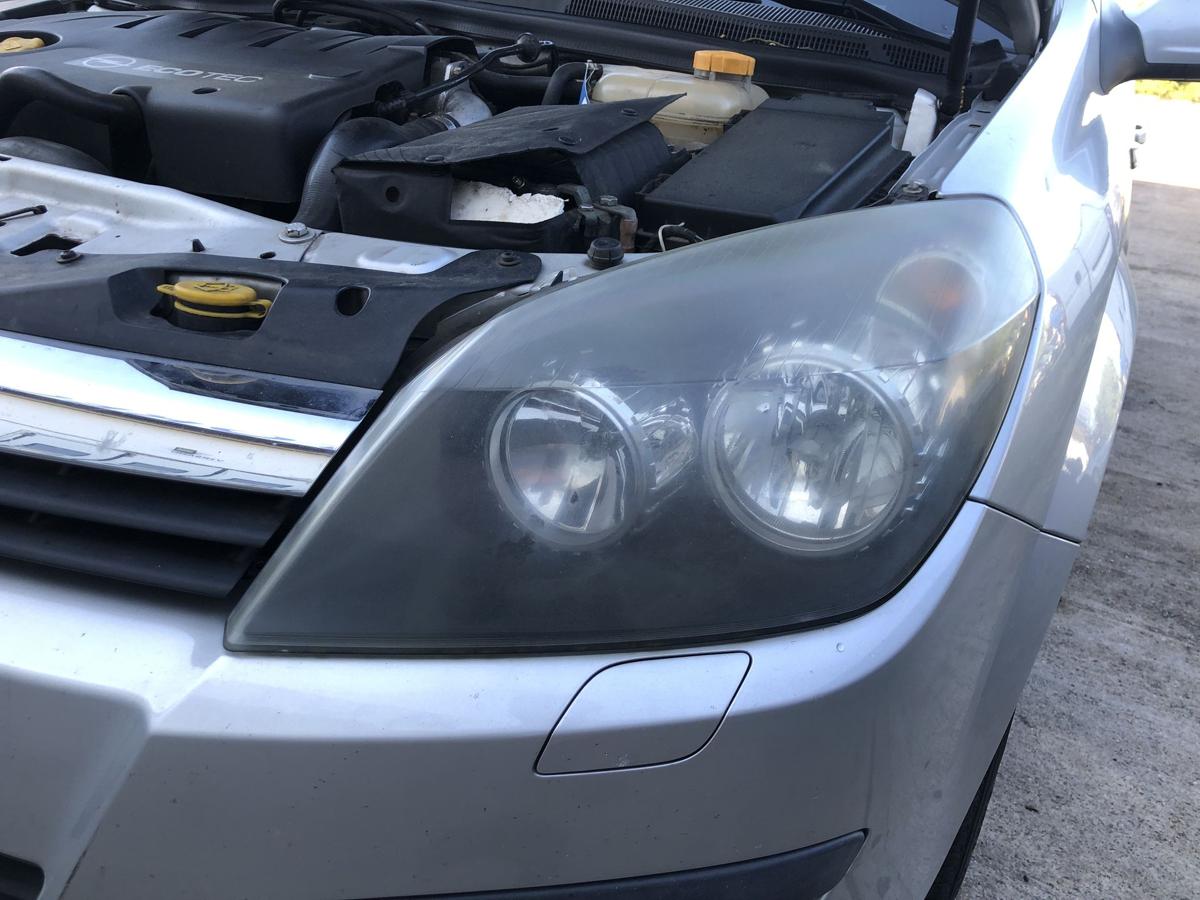Opel Astra H Caravan Scheinwerfer links Hauptscheinwerfer Halogen Tr&uuml;b Hella