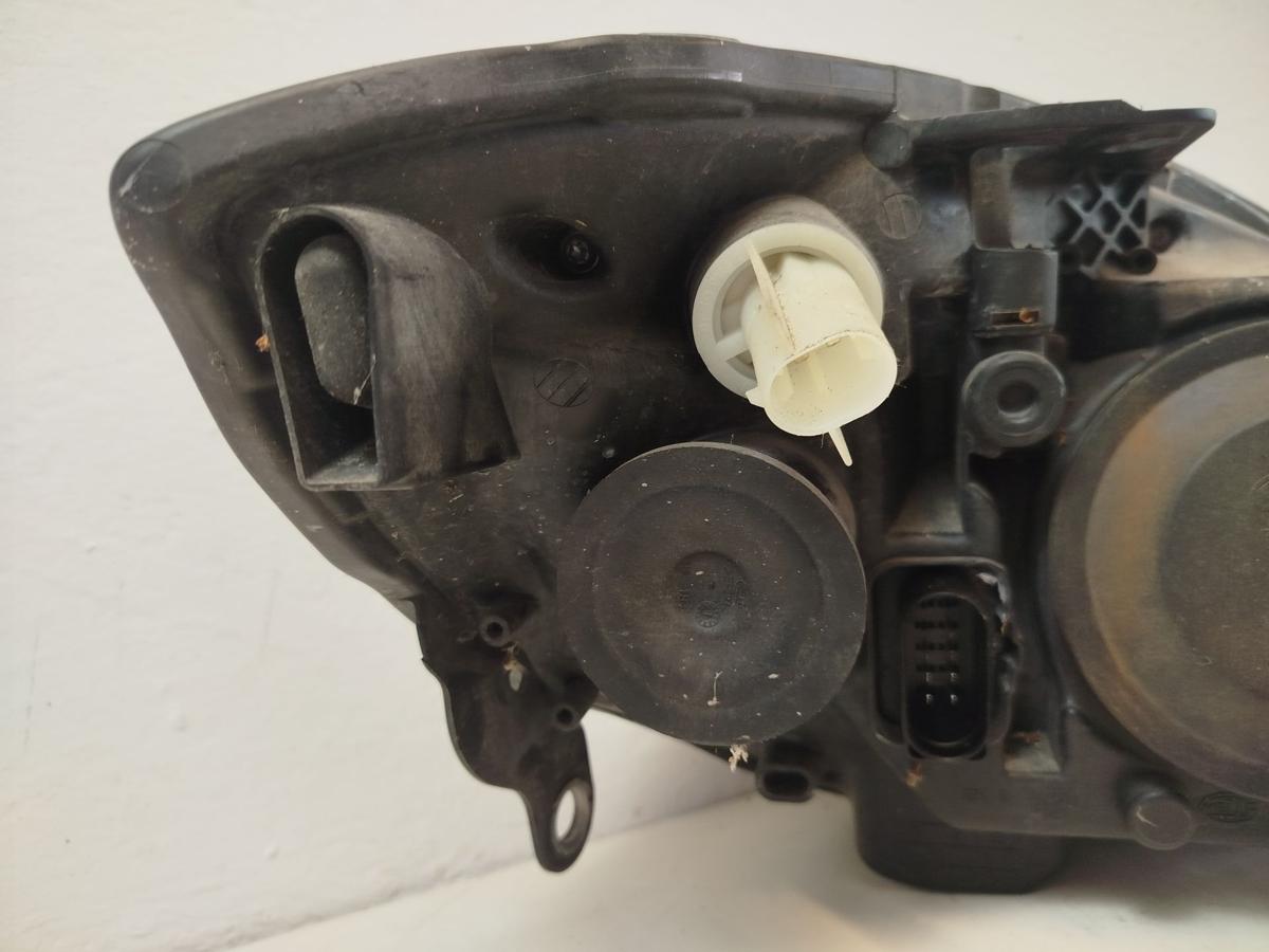 Skoda Roomster Fabia 2 Scheinwerfer links Halogen H4 Hella OE Hauptscheinwerfer