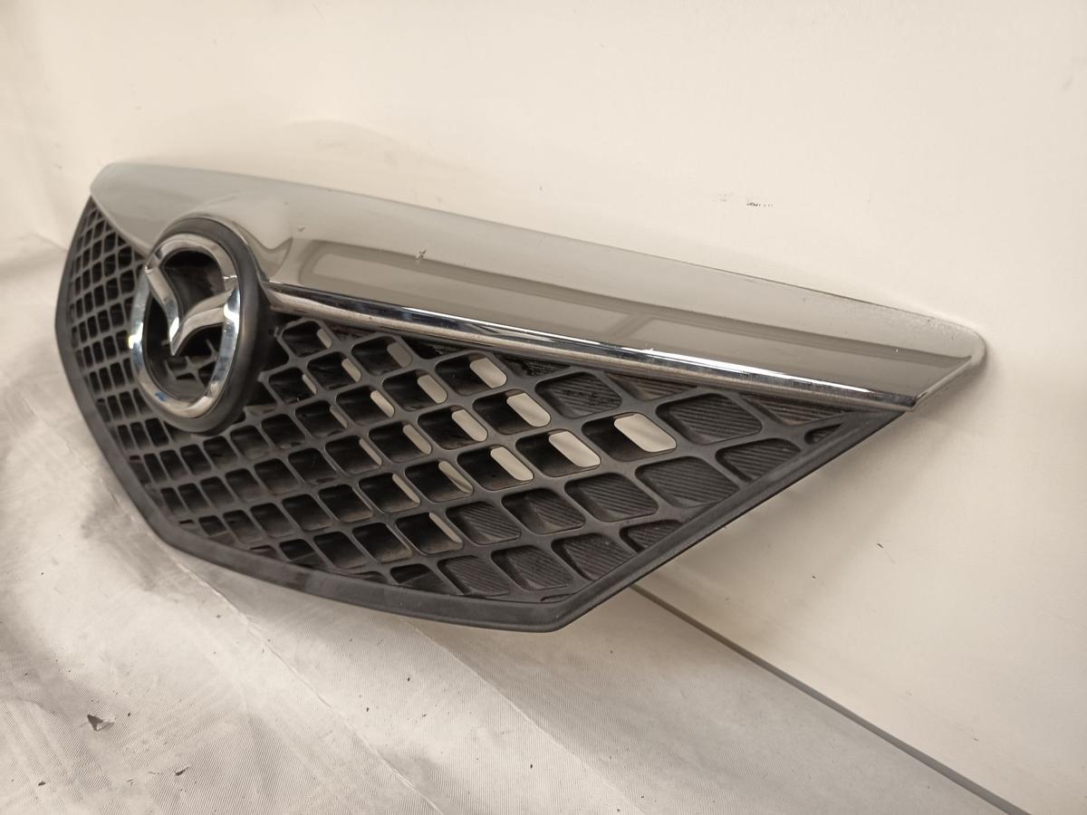 Mazda 2 DY Bj 2005 original Kühlergrill Grill mit Emblem