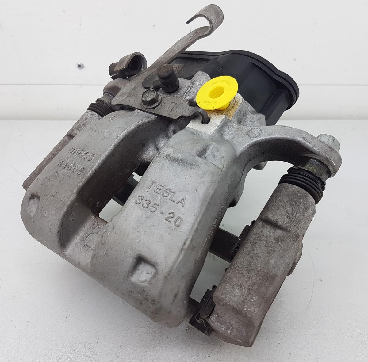 Tesla Model Y Bremssattel hinten links Bj2022 1044627-00-A inkl Tr&auml;ger
