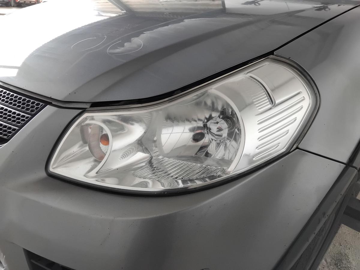 Suzuki SX4 original Scheinwerfer links Halogen mit LWR trüb vergilbt BJ2009