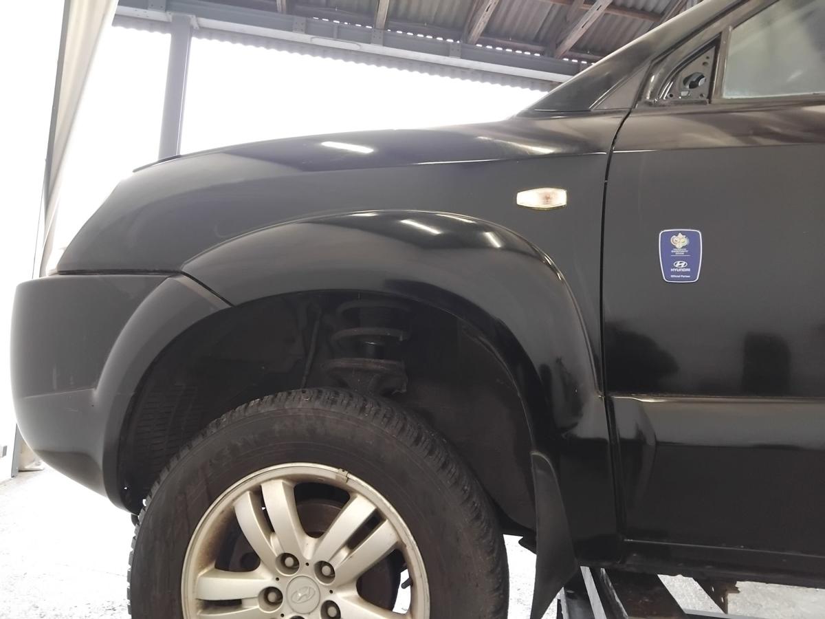 Hyundai Tucson JM original Kotfl&uuml;gel vorn links schwarz EB mit Beplankung BJ2006
