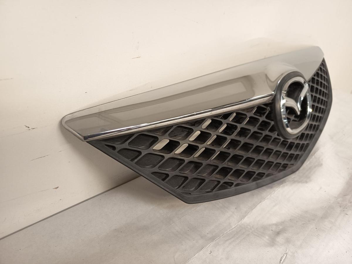 Mazda 2 DY Bj 2005 original Kühlergrill Grill mit Emblem
