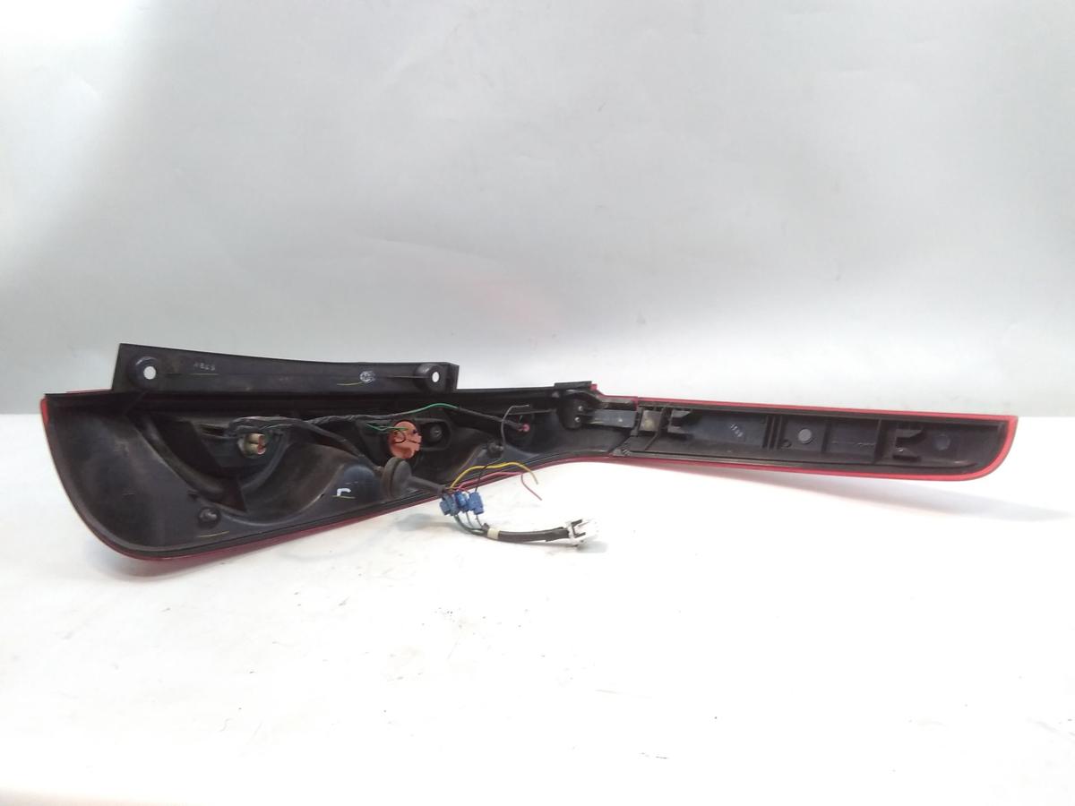 Nissan Note E11 original R&uuml;ckleuchte Heckleuchte links mit Blende oben BJ2006