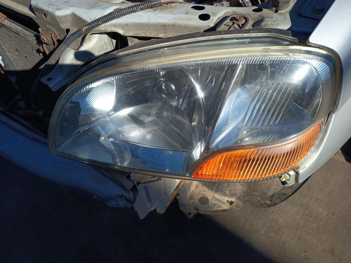 Suzuki Ignis I original Scheinwerfer links Halogen Haupt Licht Front Bj 2001