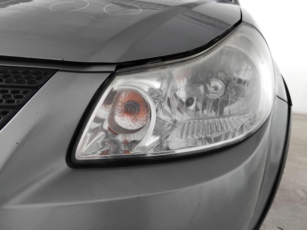 Suzuki SX4 original Scheinwerfer links Halogen mit LWR trüb vergilbt BJ2009
