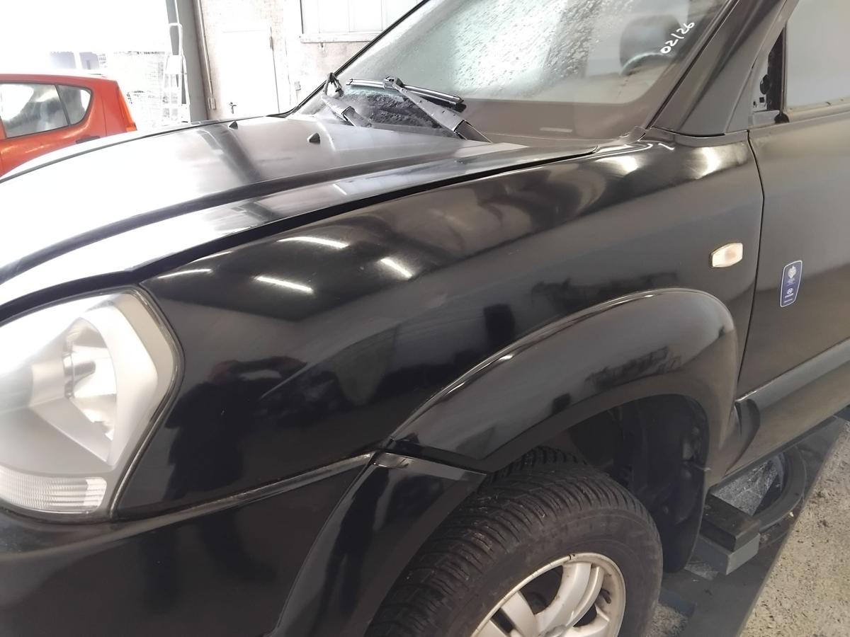 Hyundai Tucson JM original Kotfl&uuml;gel vorn links schwarz EB mit Beplankung BJ2006