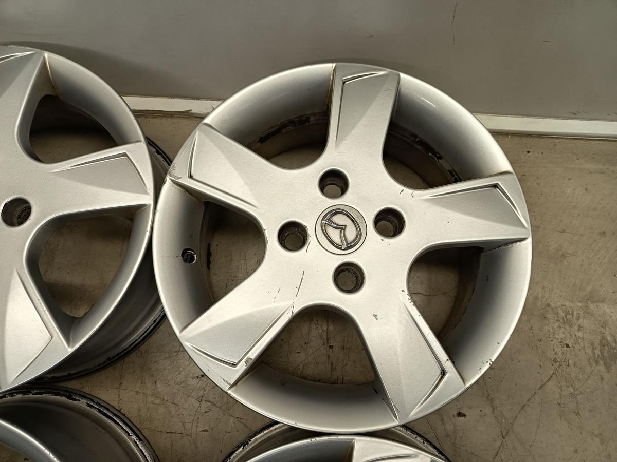 Mazda 2 Dy orig Satz Alufelgen 6Jx15 ET52,5 4x108 Bj 2006/ O.E 9965M46050