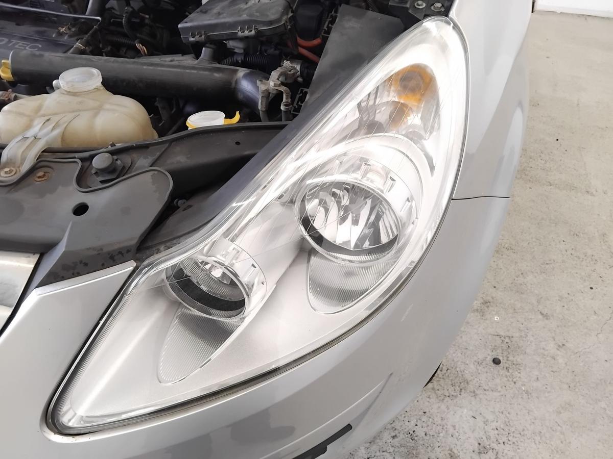 Opel Corsa D original Scheinwerfer links chrom Halogen mit LWR BJ2006