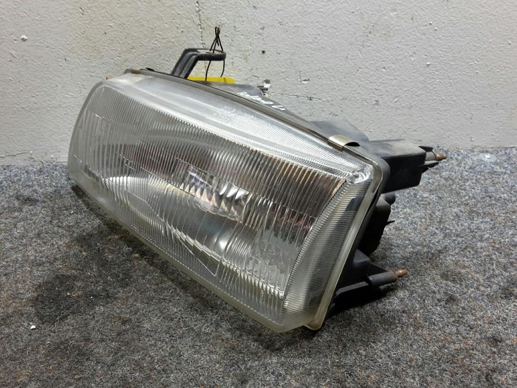 Suzuki Baleno BJ 1997 Scheinwerfer vorn links Lampe 10032074 95-99