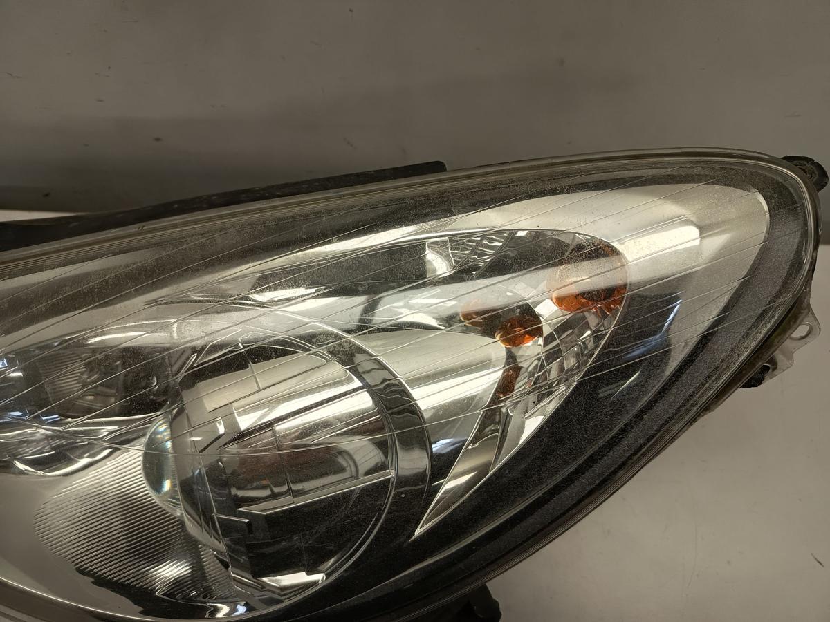 Opel Corsa D original Scheinwerfer links Halogen Kurvenlicht vor Facelift Bj 09