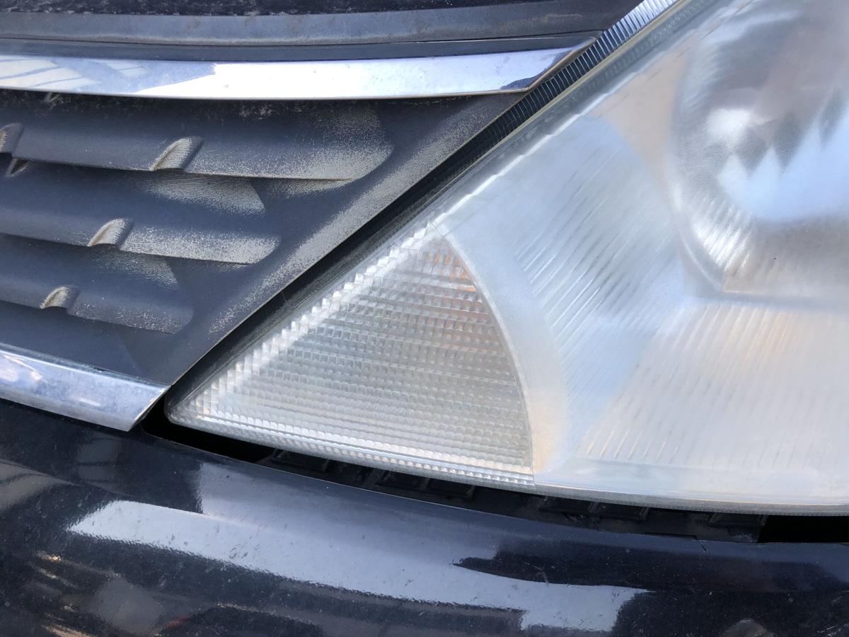 Nissan Tiida C11 Scheinwerfer links Frontscheinwerfer Halogen Lampe