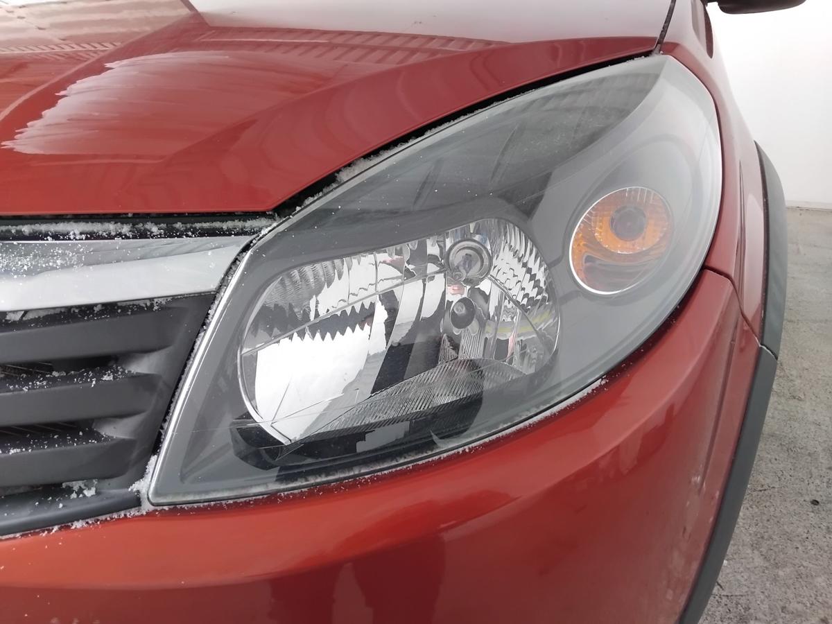 Dacia Sandero 1 orig.Scheinwerfer links f&uuml;r Bowdenzug LWR BJ2010 schwarz