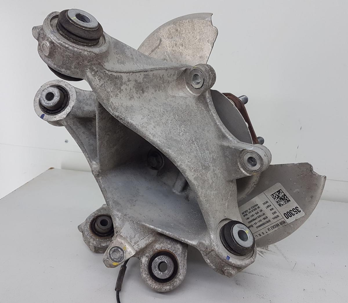 Tesla Model Y Achsschenkel hinten links Bj2022 1188411-00-F 335x20mm