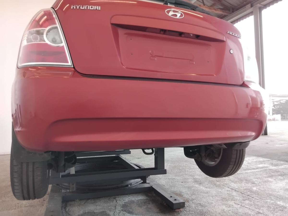 Hyundai Accent 3 MC orig Sto&szlig;f&auml;nger Sto&szlig;stange hinten 3t&uuml;rig BJ2007 N8 Tango Red