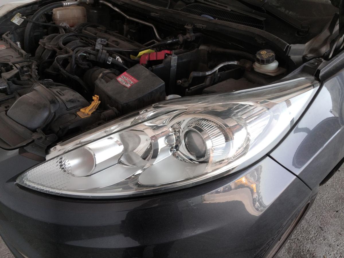 Ford Fiesta JA8 original Scheinwerfer links Hella Halogen mit LWR BJ2009