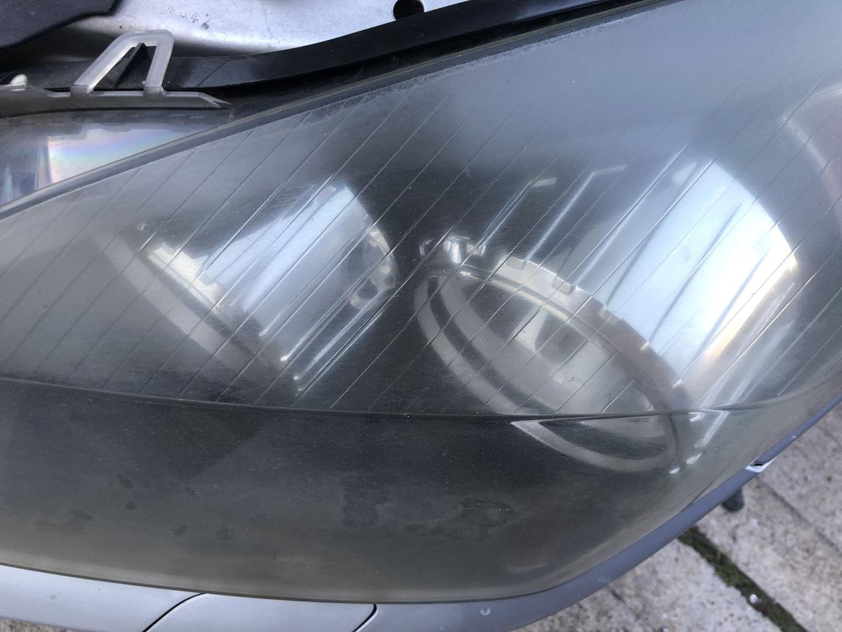 Opel Astra H Caravan Scheinwerfer links Hauptscheinwerfer Halogen Tr&uuml;b Hella