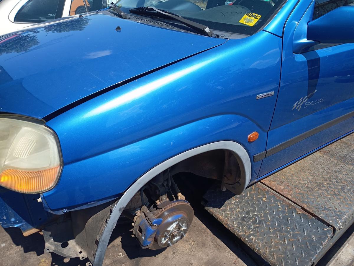 Suzuki Ignis original Kotfl&uuml;gel links Z2J Cyprus Blue Metallic Baujahr 2003