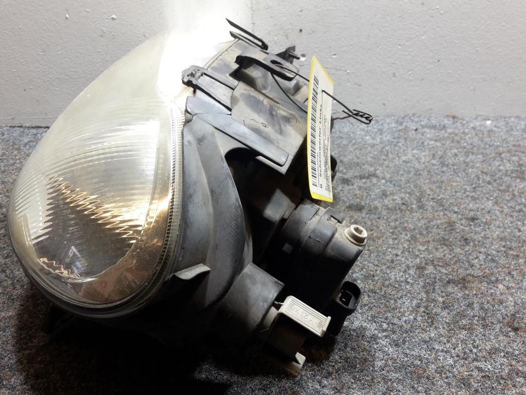 Renault Megane (1) BJ 2000 Scheinwerfer vorn links Lampe 7700427874D 99-01