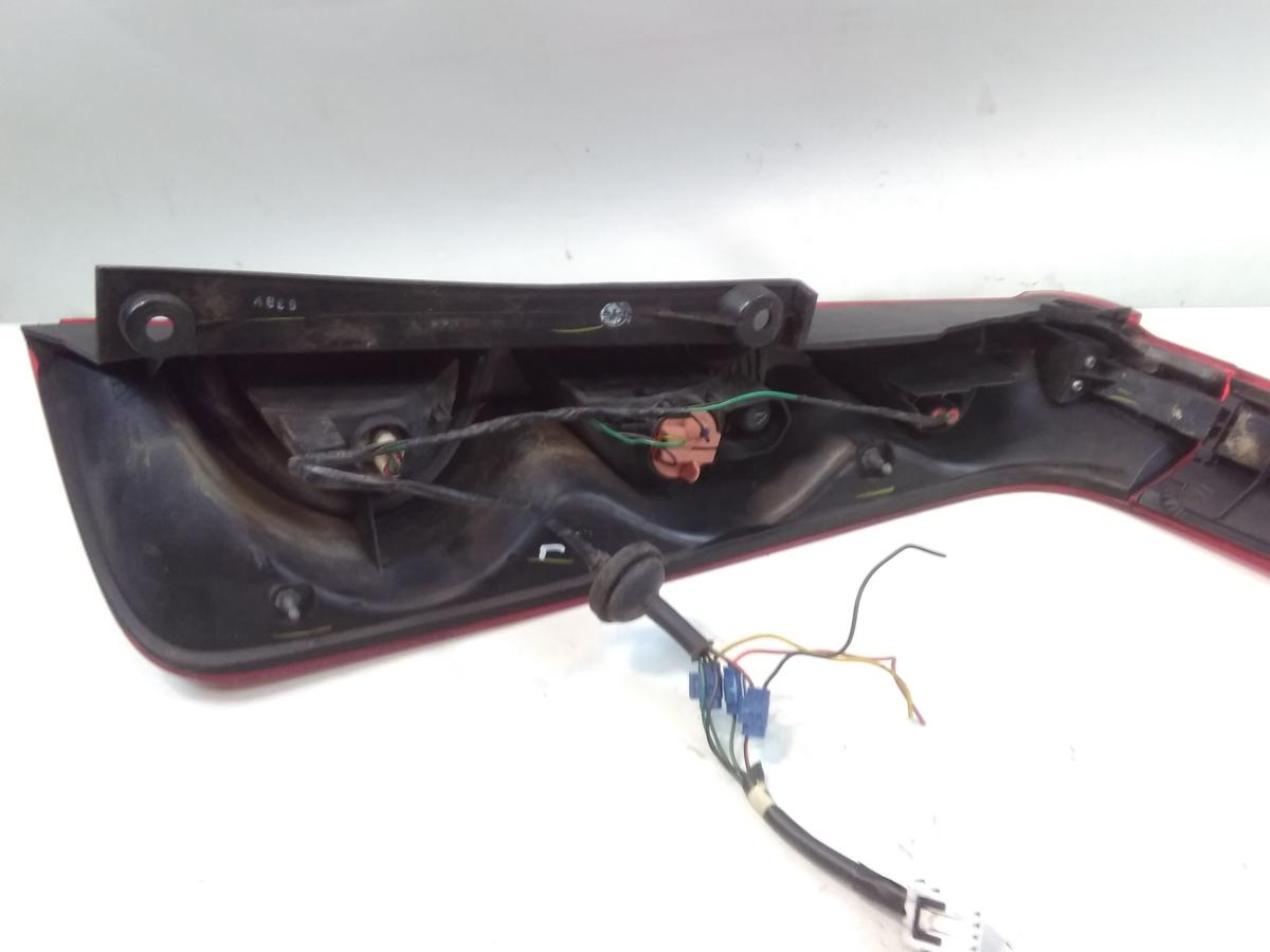 Nissan Note E11 original R&uuml;ckleuchte Heckleuchte links mit Blende oben BJ2006