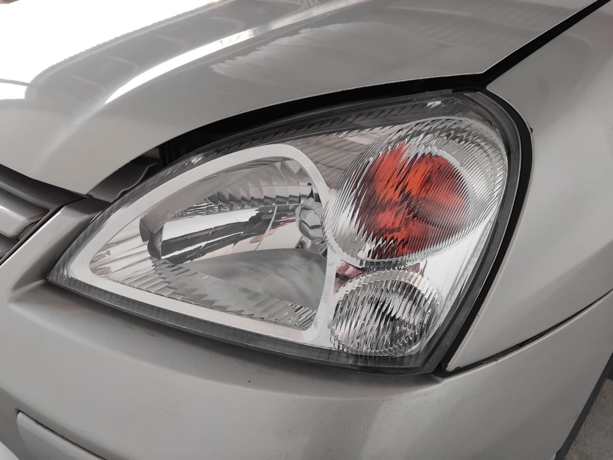 Suzuki Liana Scheinwerfer links Depo Halogen mit LWR BJ2004