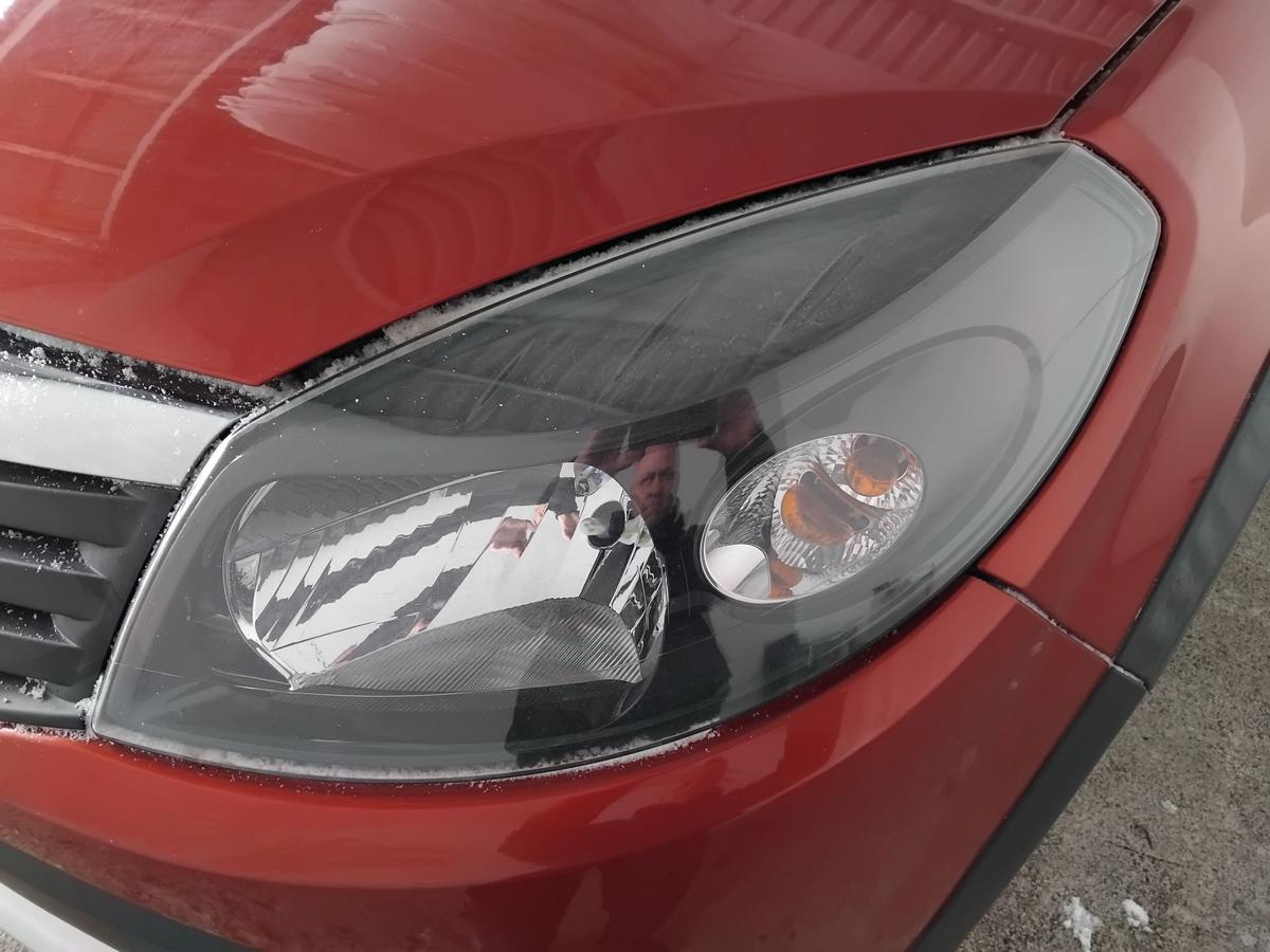 Dacia Sandero 1 orig.Scheinwerfer links f&uuml;r Bowdenzug LWR BJ2010 schwarz