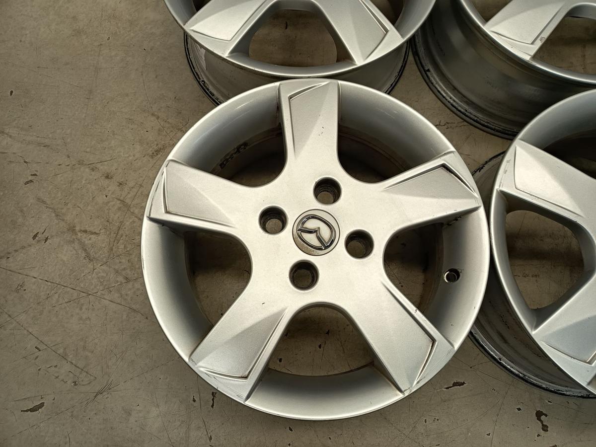 Mazda 2 Dy orig Satz Alufelgen 6Jx15 ET52,5 4x108 Bj 2006/ O.E 9965M46050