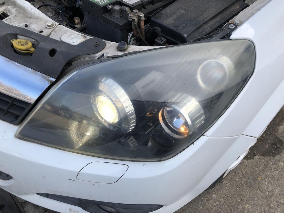 Opel Astra H GTC Scheinwerfer links Xenonscheinwerfer Tr&uuml;b OEM Hella Lampe